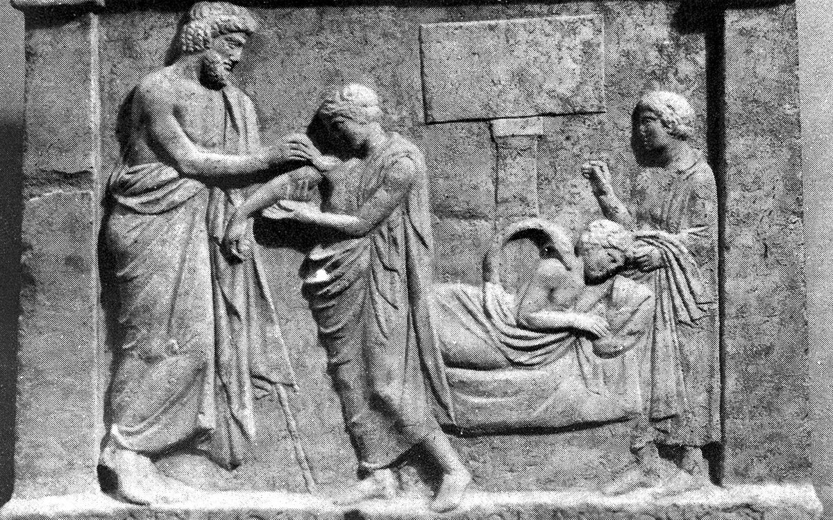 Ancient votive relief of Asclepius healing a patient in the abaton